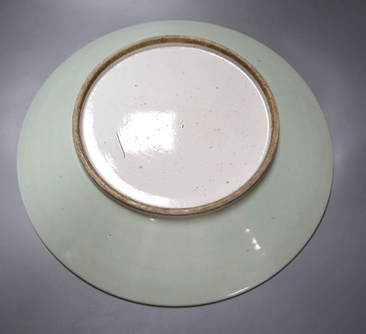 A 19th century Chinese carved celadon glazed charger, 38cm
